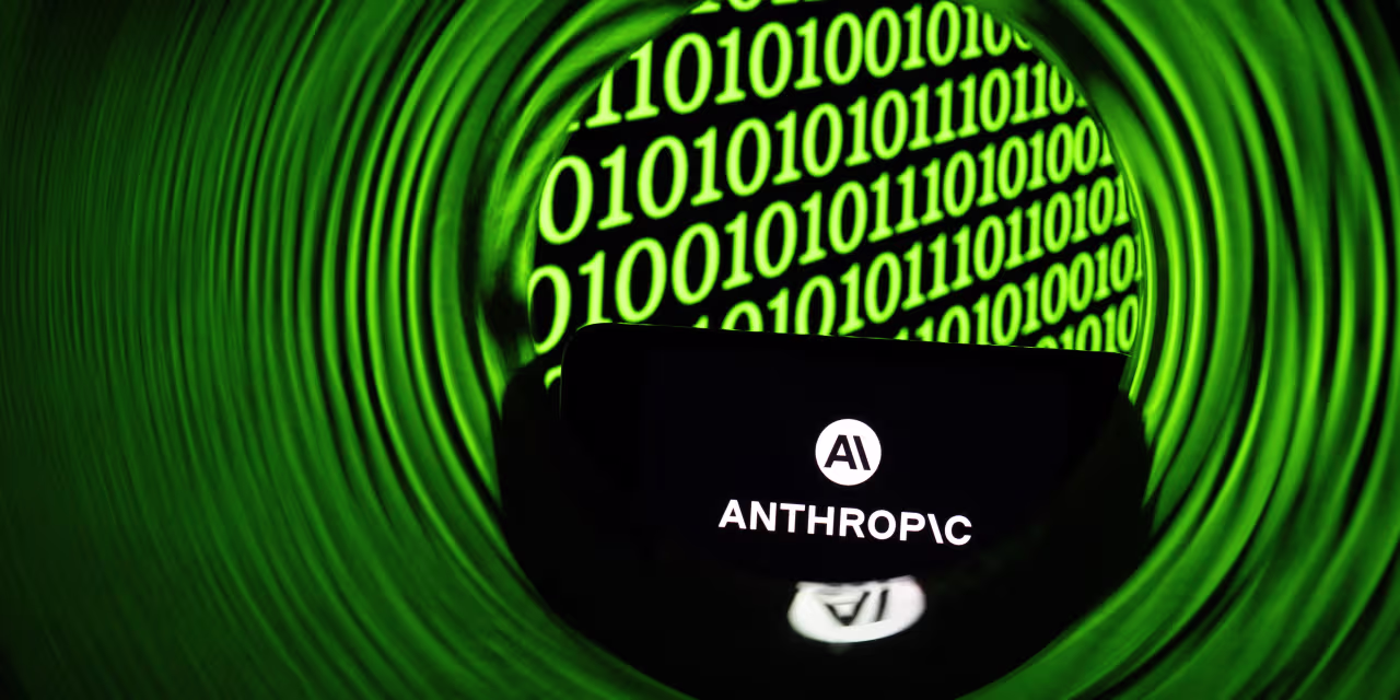 Smartphone displaying the Anthropic logo against a background of binary code in green